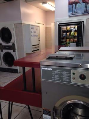 Vending machines for laundry supplies and snacks.