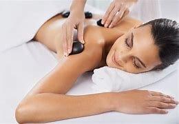 Tension melts away with warm stone massage.