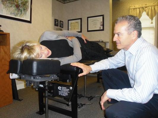 Dr. John explaining that chiropractic care should never be painful