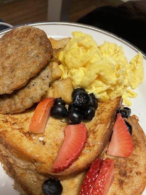 French toast, fresh fruit, eggs and sausage!!!! Seriously good eats