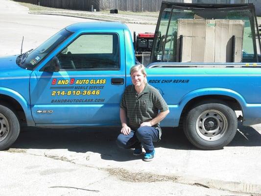 photo of the owner with his truck.