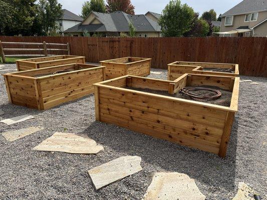 Custom garden beds, flagstone paths and pea gravel.