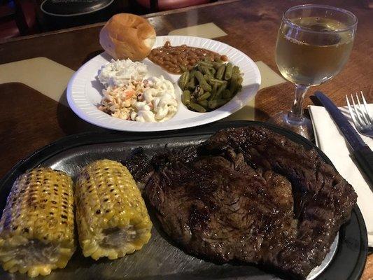 Steak, grilled corn, potato salad, mac salad, great been and baked beans! Yummy!