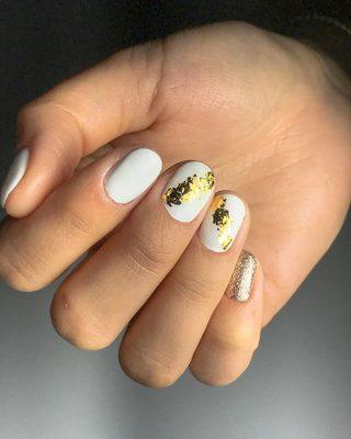 Gel Manicure with warm gold glitter and foil design