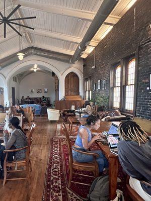 Such beautiful hard wood floors and exposed bricks