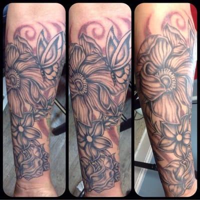 Custom half sleeve tattoo done freehand by Island City Tattoos Artist.. Ray