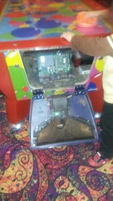 Machine broken, so they leave it plugged in and exposed wires to give the kiddies a real shocking experience