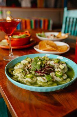 Aguachiles verdes- butterfly shrimp marinated in lime and pepper, served with onion, cucumber, and cilantro. Spicy and refreshing.