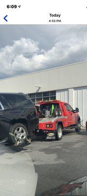 Chevrolet suburban being towed away by ADVANTAGE Wrecker !! Nice job !!