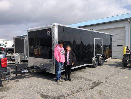 Mother and son buy a race car trailer