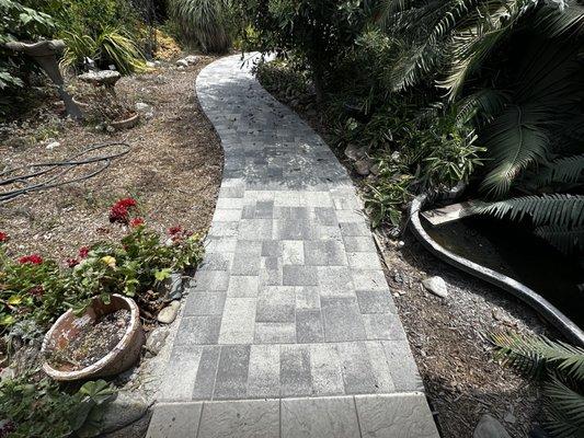 Enhance your curb appeal with our inviting paver walkways--perfectly crafted for beauty and durability!