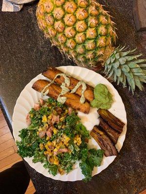 Black Bean Flautas with kale salad with broiled corn and shallot, guacamole, and aïoli (vegan)... I added the fried plantains myself.