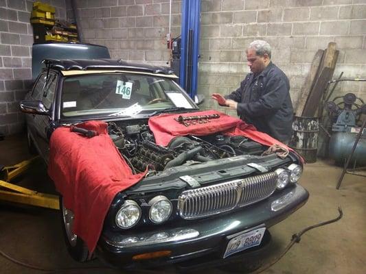 Luis takes apart a jaguar engine