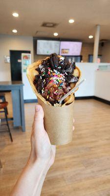 Bubble waffle with chocolate ice cream, chocolate syrup, and oreo