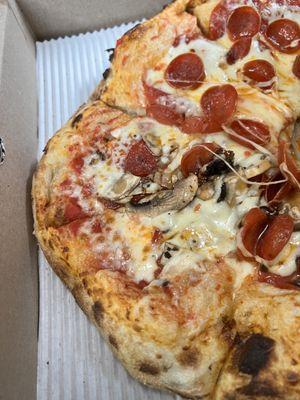 Half pepperoni and half pepperoni & mushrooms