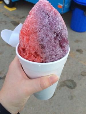 A 16 oz "Frigid Frog" snow cone with grape and strawberry. (More like 24 oz if you include the huge mountain on top!!)