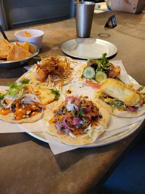 The Tacos, from the top clockwise: Shrimp Tempura, Pork Burnt Ends, Fish, Lamb Barbacoa, Pecan Smoked Chicken.