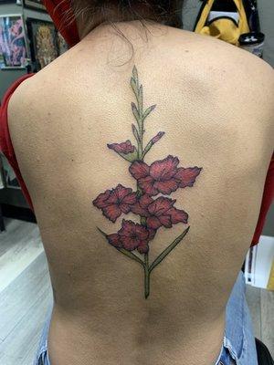 Gladiolus tattoo done by Izzey