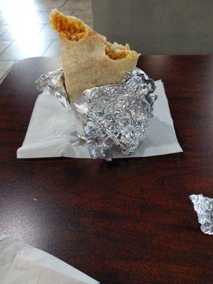 Burrito in the suggested style of unwrap-from-the-end.  Great advice from counter man, I could have put to use over the past 40 years.