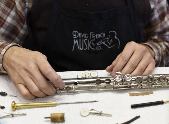 A close up of a flute repair