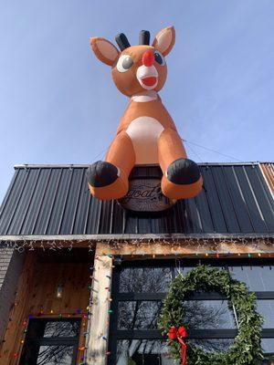 Yea, this big dude is chilling on top of The Loaded Goat ready to report to Santa if you've been naughty or nice.