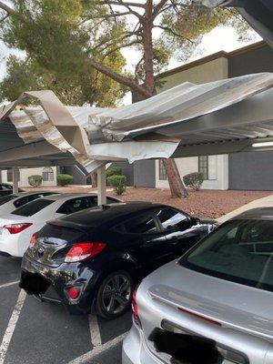 Damage done to the parking cover. tenant parked in an unauthorized space that is used for the handicapped parking spot next to it.