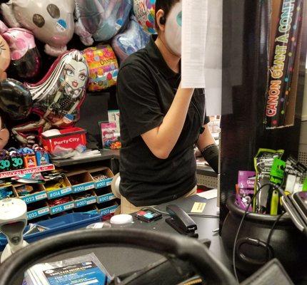 Employee doing her make up while holding up the whole check out line - at the only open cash register.  She said her manager made her do it.