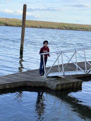 My 13 year old having a blast fishing