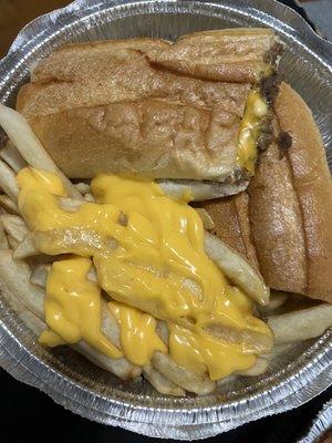 Philly cheese steak sandwich with cheese fries