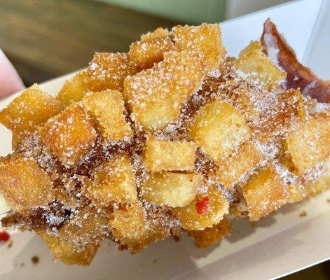 Close up of potato corn dog with light sugar texture