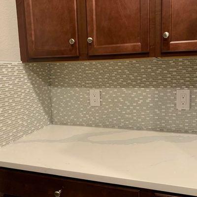 Some more backsplash! Tesoro in color Glacier Ice, and a diamond grout. Once those under cabinet lights are in, it will really shine