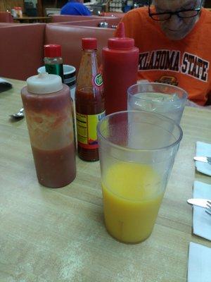 The waitress keeps walking by with condiments and drinks.