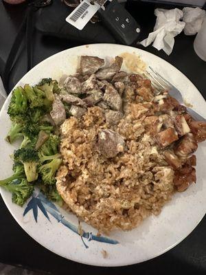 Steak and chicken entree with broccoli.