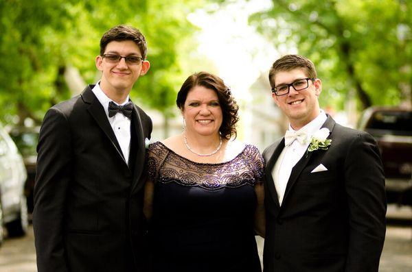 Family portrait of a mother and her sons; the groom and best man