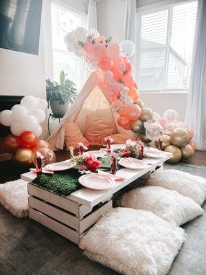 Kids birthday fairy party picnic set up with teepee and massive balloon garland