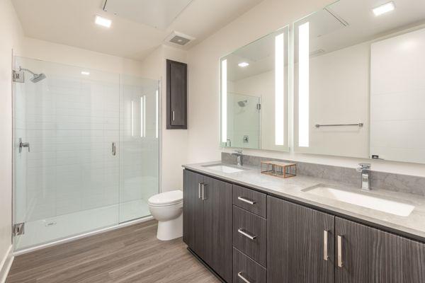 Large walk in closet with floor to ceiling industrial style clothing racks.