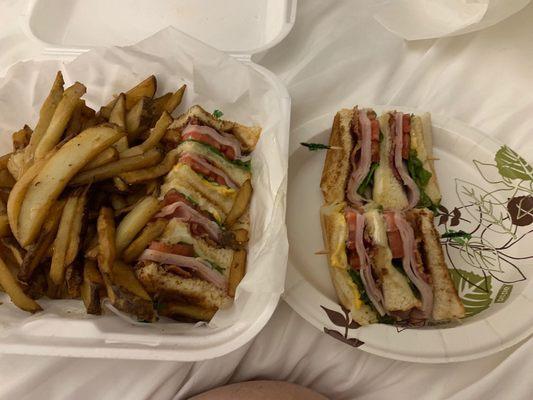 A huge club sandwich and lots of fries. Let's eat!