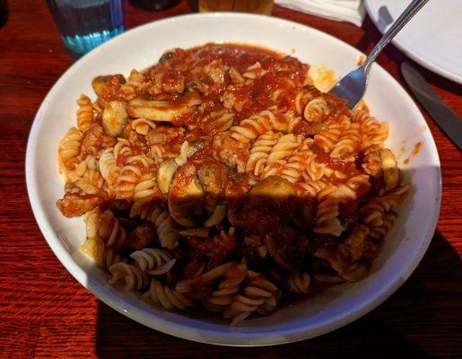 GF house special pasta. Noodles, tomato sauce, bits of sausage, sliced mushrooms. Really good.