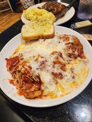 Delicious Chicken Parmesan with grilled shrimp and loads of cheese.