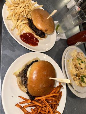 Two champignon burgers one with frites & one with sweet frites