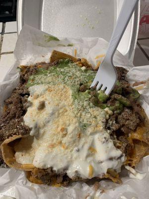 Carnes asada nachos and i asked them to add fried beans ( chips supreme I think they have it listed on the menu)