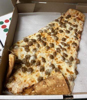 Slice of sausage pizza