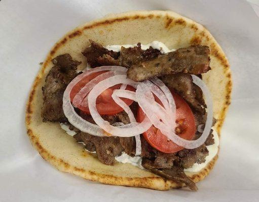 Gyro straight off the cone served with fresh made tzatziki sauce,tomato and onion.