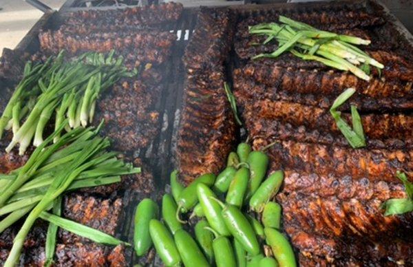 Baby Back Ribs- marinated in homemade Mexican adobo, grilled over mesquite coals