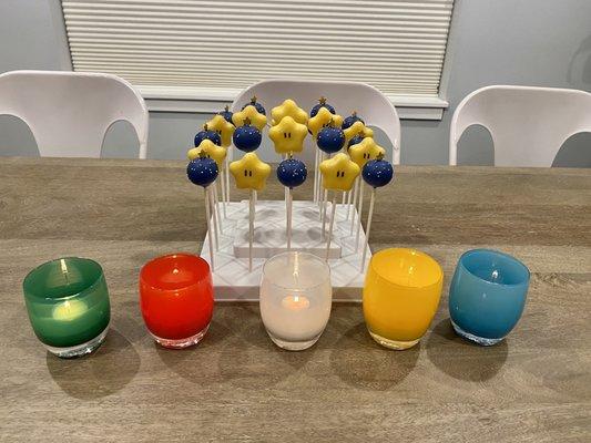 Mario Star cake pops with funfetti, and blue round cake pops with vanilla filling.