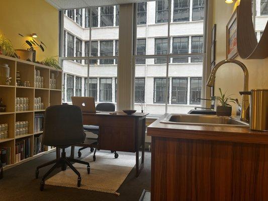 The front desk, sink and herbal pharmacy