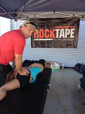 Dr. Bill doing Active Release Techniques (ART) at a crossfit event.