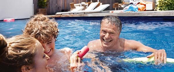 Siemens has waterproof hearing aids! You can hear in the pool and jacuzzi.