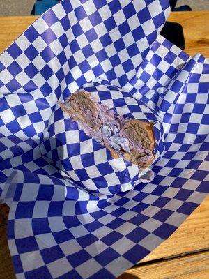 Chocolate chip bagel with blueberry cream cheese.