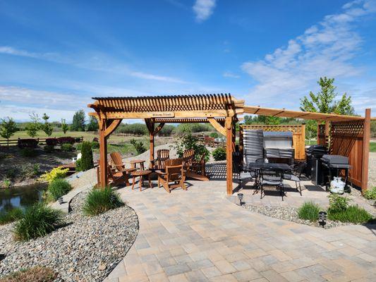 Pergola seating and outdoor kitchen.